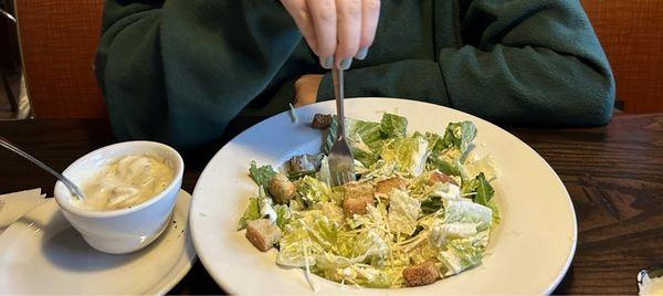 Caesar salad and cup of clam chowder