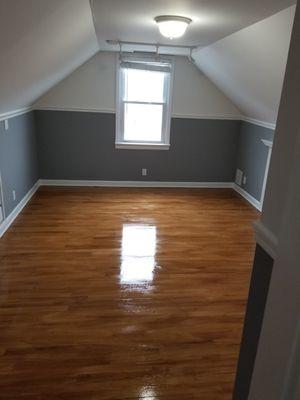 Bedroom / Freshly painted walls, ceiling, trim and varnished floor.