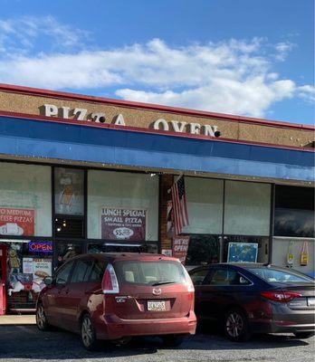 The store front of Pizza Oven in Riverdale, MD. It's a hike for me, but worth it.