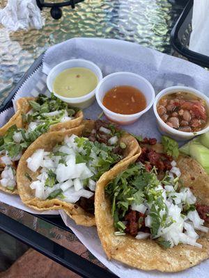 Steak, chorizo, chicken tacos on corn tortillas