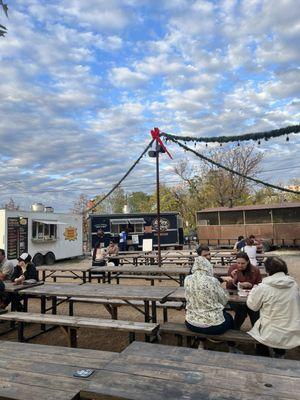 Outdoor seating with food trucks