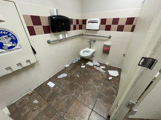 DISGUSTING BATHROOM, PAD WRAPPERS, TOLIET PAPER EVERYWHERE.