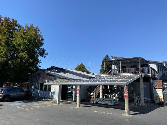 South entrance with solar panels and bike racks