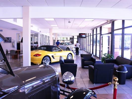 Ford Model A in the showroom next to a lounge area