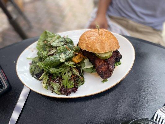 Spicy Nashville Chicken Sandwich with a side of salad