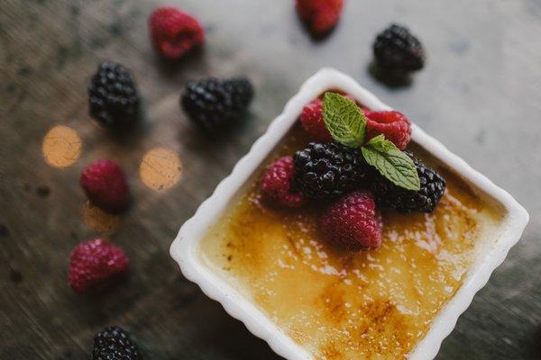 VANILLA BEAN CREME BRULEE
soft, rich custard topped with caramelized sugar and fresh berries