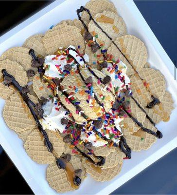 Cookie Dough Nachos! The Ultimate Dessert...Waffle Cone Chips with a Scoop of Cookie Dough topped with Chocolate Caramel and Whip Cream!