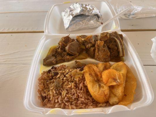 Curry Goat includes rice & cabbage