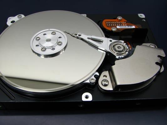 Hard drive with a damaged platter surface.