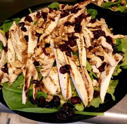 Summer Grilled Chicken Salad: Crispy Romaine Lettuce, Baby Spinach, Walnuts, Cranberries, Grilled Chicken, and Crumbled Blue Cheese