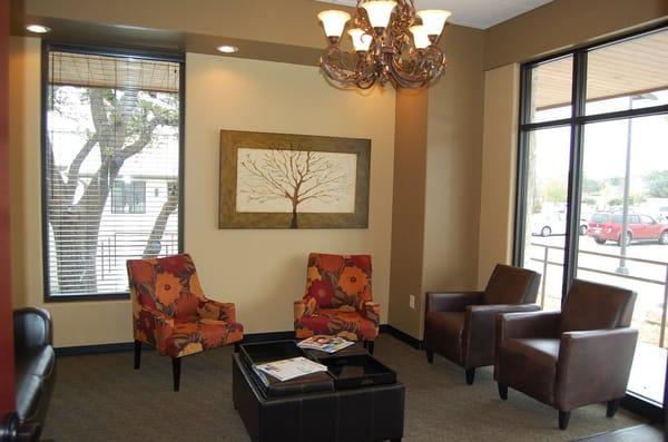 Comfortable reception area with television,  coffee bar, children's area, WiFi and computer for your convenience.