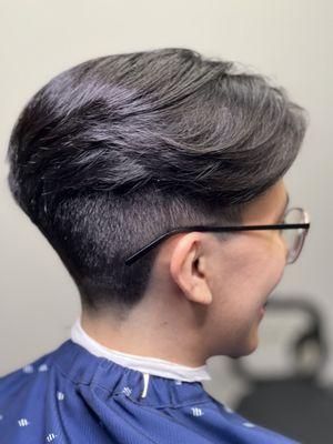 Under cut, with feathered scissor work up top.