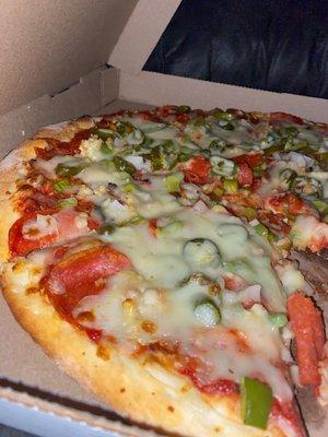 Custom 16in: Pepperoni's, Bell Peppers, Roasted Garlic, Onions, Jalapeños, red marinara.