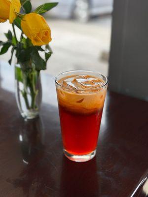 Thai Ice Tea: on the sweeter side but pairs well with the bold flavors of their food.