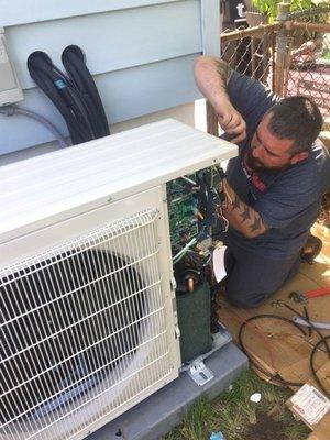 Jerry Jr. working on an installation of a Mini-Split (Ductless System)