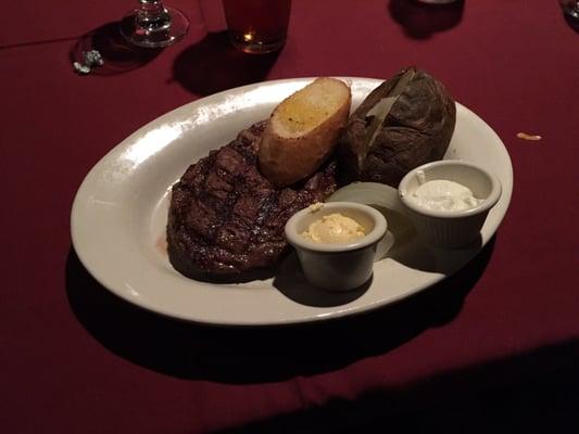 9 oz rib eye with baked potato.