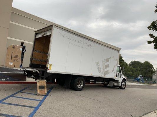 24ft truck with lift gate loading dining Room set and bedroom set at big lots Montebello