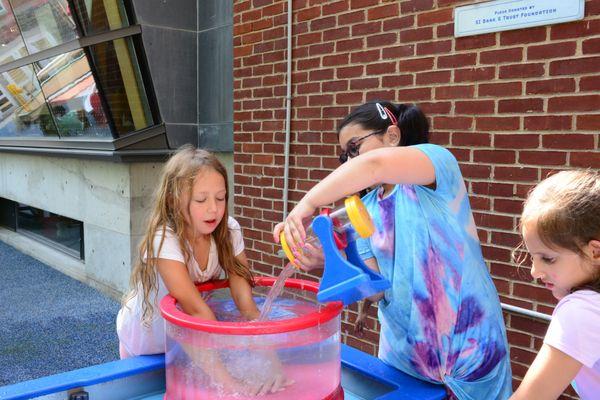 kids playing with the watertable