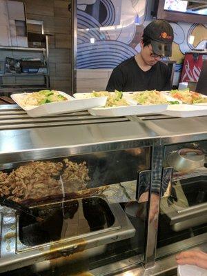 Grilling masses of chicken for the hungry crowd