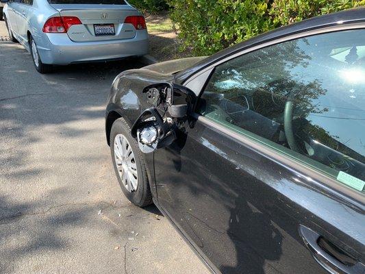 Driver side mirror damage.