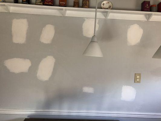 Kitchen wall, had huge holes from shelves