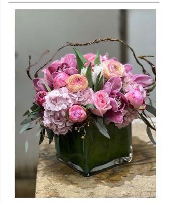 What a spectacular piece this is an all pink tight and lush arrangement from Florique Flower shop