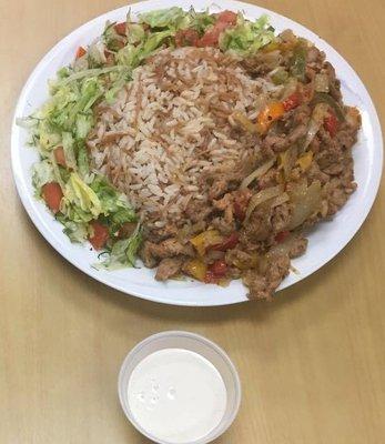 chicken shawarma over rice, salad & tahina sauce