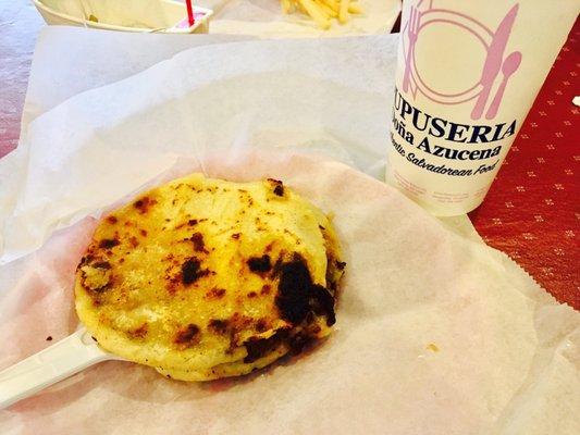 Pork and cheese pupusas with melon de pina juice