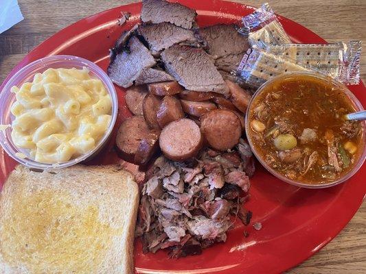 Three meat combo: brisket, sausage and pulled pork. Sides: Mac n cheese and Brunswick Stew.