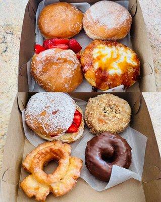 clockwise from upper left: cherry, guava, creme brulee, crumbly crumb, devil's food cake, old fashioned glazed, strawberry shortcake x2