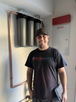 This is the amazing installer, Blake, standing in front of the system that he just installed inside my garage.