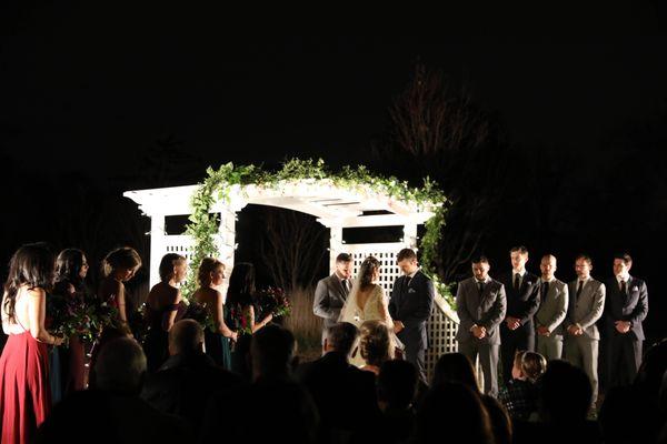 Outside trellis. We brought our own flood lamps to help illuminate the ceremony. While the house provides some lighting, it isn't enough.