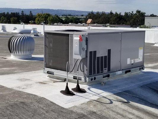 We installed this new Carrier rooftop unit for an Orange County business owner.