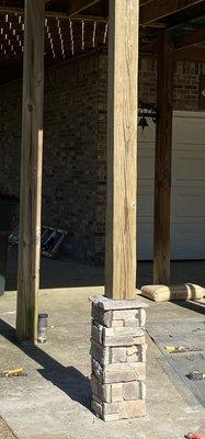 The bottom of these posts had rot. Daniel cut that off,  cemented new footers and then finished with masonry. Great job!