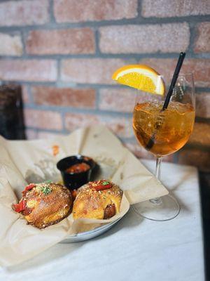 Spicy garlic knots and aperol spritz