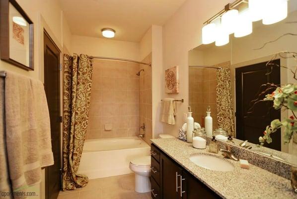 Huge bathtubs with modern, yet elegant tile work.