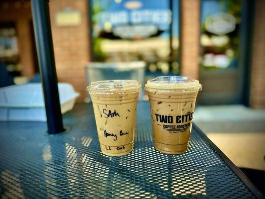 Honey Bee iced oatmilk latte and Penguin iced Oatmilk latte.