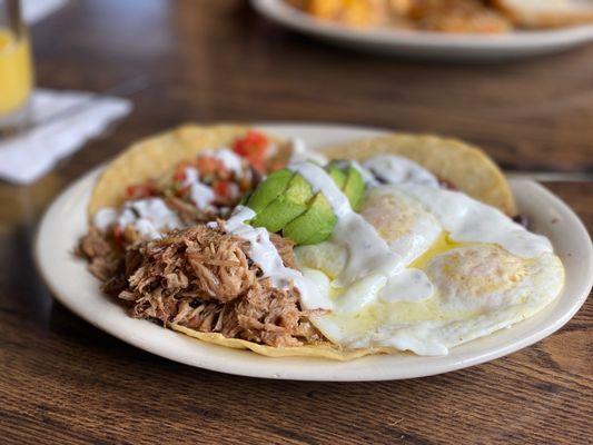 Huevos rancheros with shredded pork.