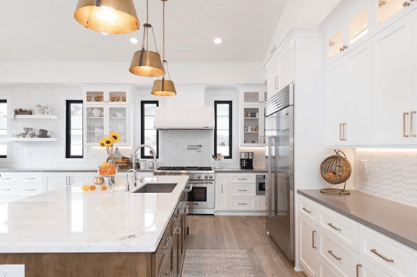 Let's get cookin' in this amazing kitchen! Check out the contrasting cabinets and that island - it's big enough to dance on!