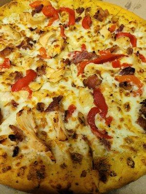 Chicken, bacon, and roasted red pepper with garlic parm sauce on a hand tossed crust