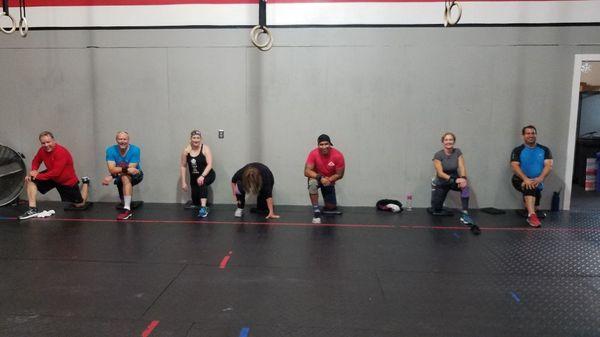 Here our members are doing what is known as the "couch stretch". It lengthens the quads and hip flexors.