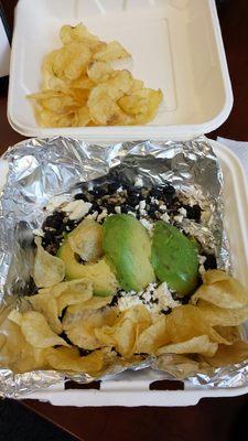 Quinoa salad with a bunch of chips dumped on top of a warm salad.  Odd.