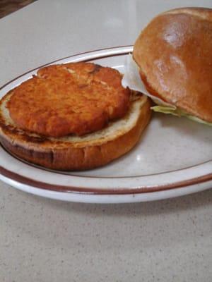 Salmon burger is much smaller than the bun and definitely breaded & fried