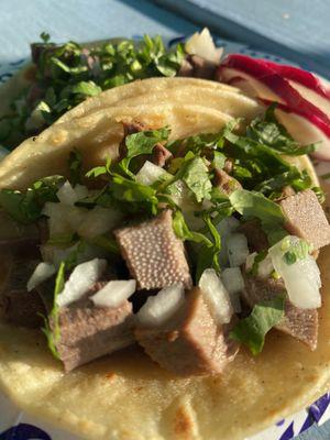 Lengua tacos with HOT sauce.