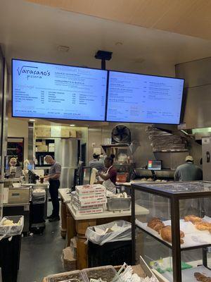 Front counter the see baking pizza