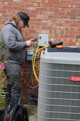 Tech working on HVAC tune-up