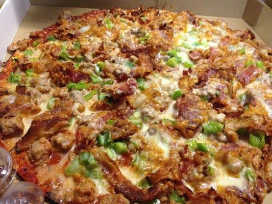 Sausage, bacon, extra cheese, and green peppers...