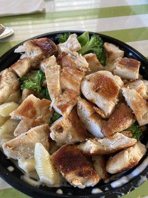 Grilled Chicken on Mac n Cheese bowl. Heavy on chicken, light on broccoli and Alfredo sauce. Really tasty and well cooked pasta.