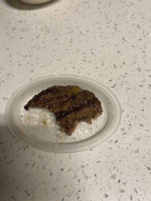 Burnt overcooked hamburger steak