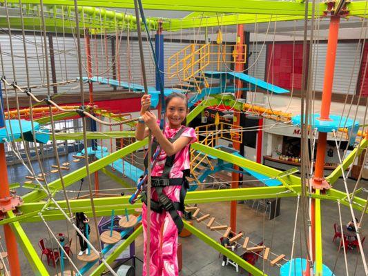 Girl smiling on the ropes course